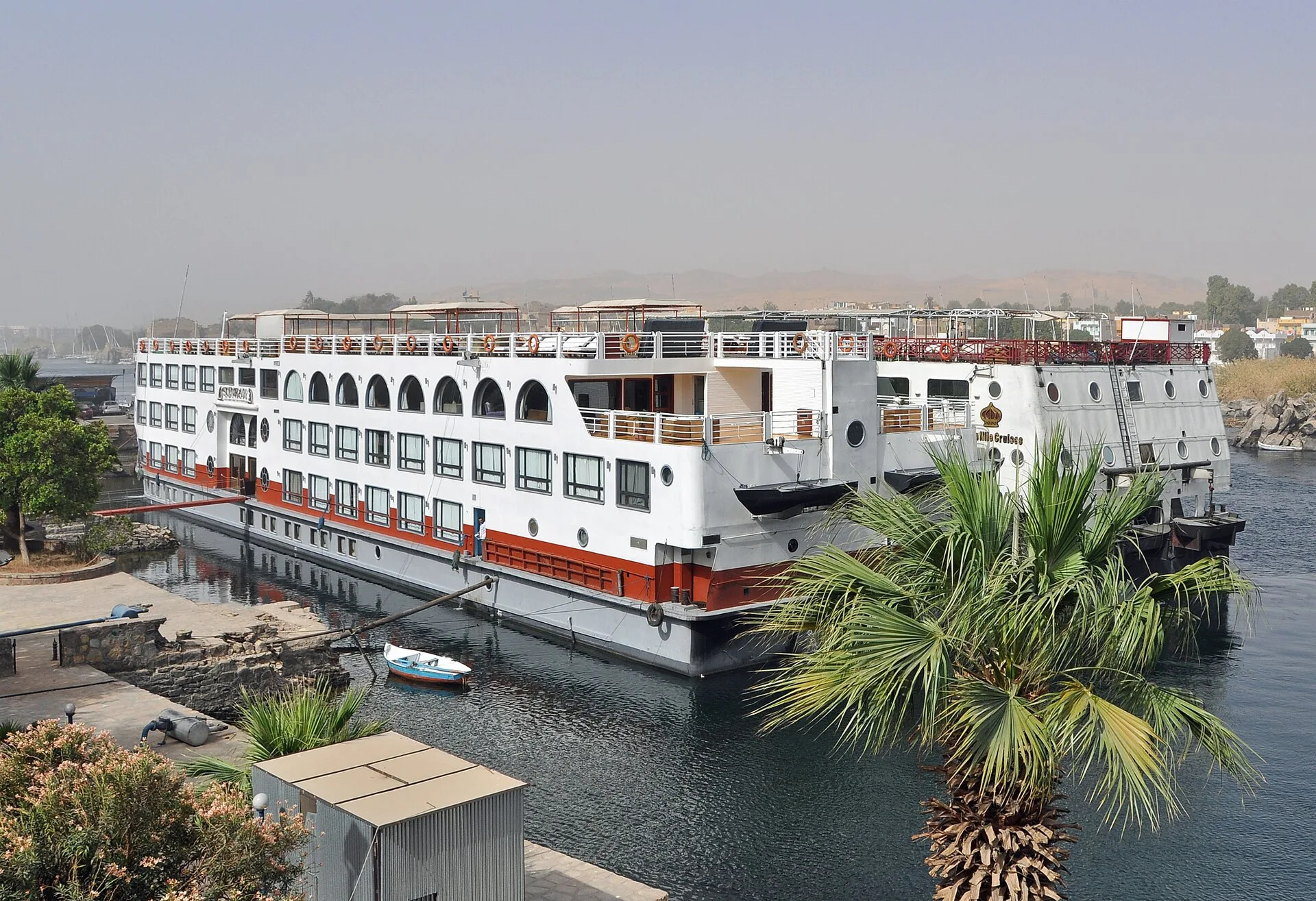 Nile river cruise ship moored on the riverbank at Aswan