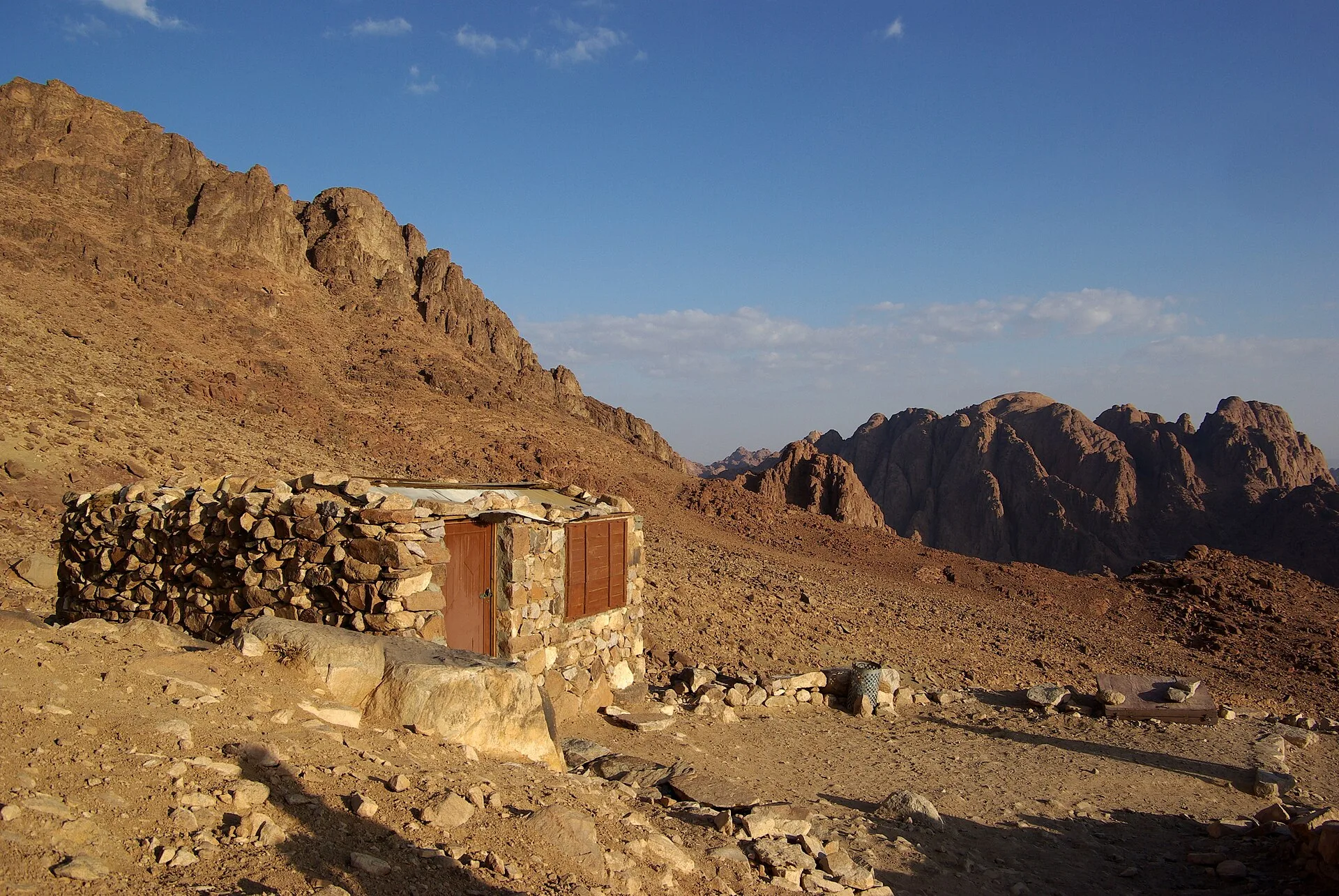 Stone hut beside the trail up Mount Sinai among granite peaks
