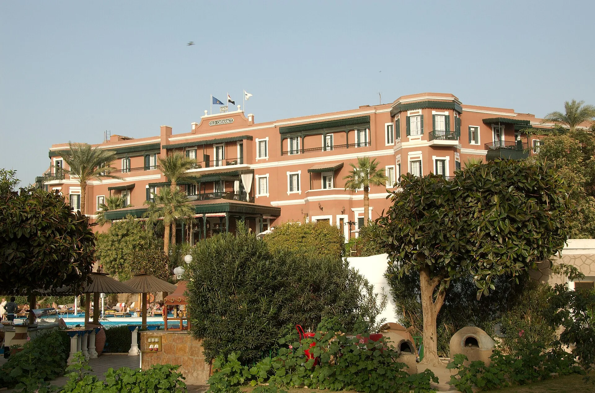 Gardens and pool area in front of the Old Cataract hotel's historic building
