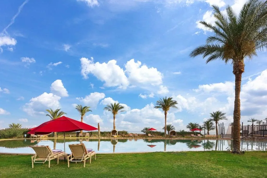 Lagoon pool with palm trees at the resort