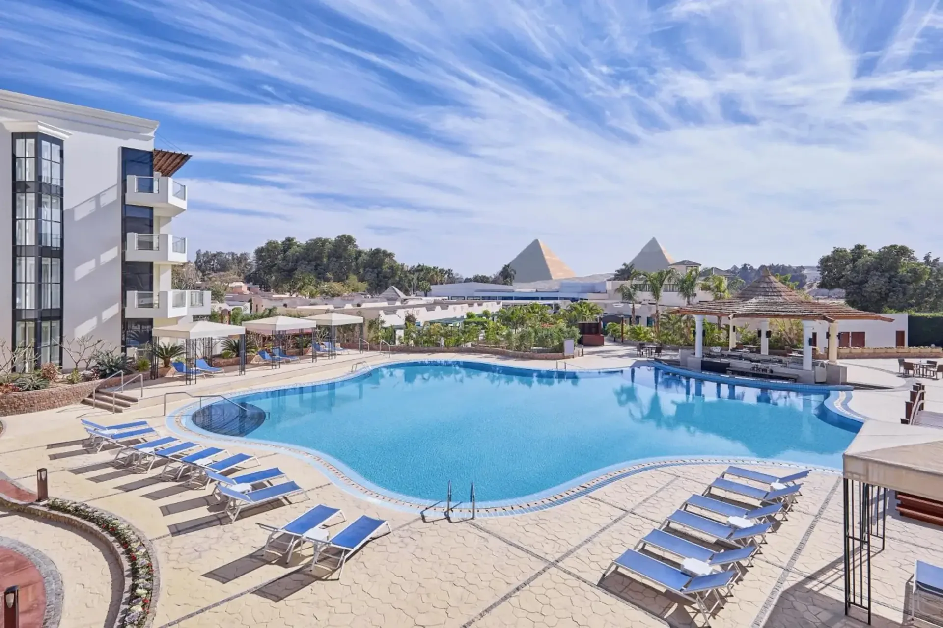Pool at Steigenberger Pyramids Cairo with the Giza pyramids beyond